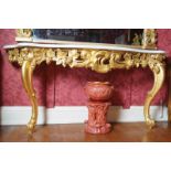 NINETEENTH-CENTURY CARVED GILTWOOD CONSOLE TABLE  the white marble top with serpentine front,