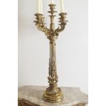 LARGE ORMOLU FIVE LIGHT CANDELABRA of four scroll arms, raised on a reeded flower and scallop