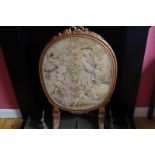 NINETEENTH-CENTURY CARVED GILTWOOD FRAMED TAPESTRY FIRE SCREE the oval panel depicting figures