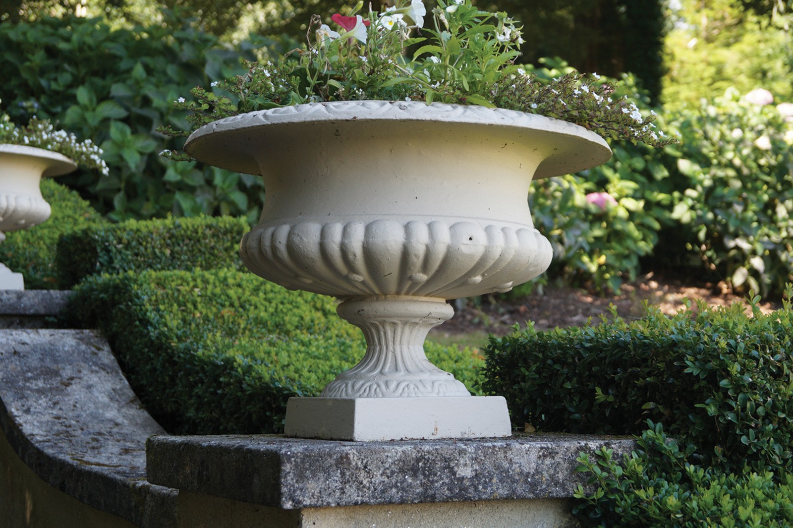 ﻿PAIR OF NINETEENTH-CENTURY CAST-IRON JARDINIÈRES ﻿each with a ribbed bowl raised on a turned