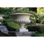 ﻿PAIR OF NINETEENTH-CENTURY CAST-IRON JARDINIÈRES ﻿each with a ribbed bowl raised on a turned