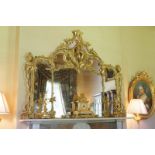 GEORGIAN CARVED GILTWOOD CHIPPENDALE OVER MANTLE MIRROR the triple plate within a moulded and