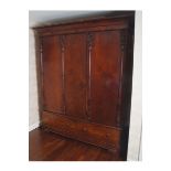 WILLIAM IV PERIOD MAHOGANY WARDROBE the cavetto moulded crown above three panelled doors, between