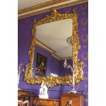 ﻿MONUMENTAL GEORGE III PERIOD CARVED GILTWOOD FRAMED MIRROR ﻿the rectangular plate with serpentine