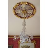 LATE NINETEENTH-CENTURY CRYSTAL THREE-TIER CHANDELIER of six lights with scroll arms, hung with