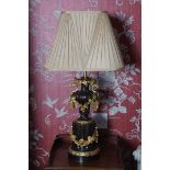 PAIR OF ORMOLU AND BRONZE STEMMED TABLE LAMPS WITH SHADES each with vine and floral swags Direct all
