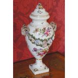 PAIR OF NINETEENTH-CENTURY PORCELAIN POLYCHROME URNS AND COVER each of baluster form with rams