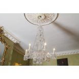 LATE NINETEENTH-CENTURY CRYSTAL FOUR-TIER SIX LIGHT, SCROLL ARMED CHANDELIER  hung with multiple