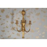 PAIR OF CARVED GILTWOOD AND GESSO WALL-LIGHTS each of two-scroll arms, emanating from a rams head