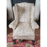 IRISH NINETEENTH-CENTURY PERIOD MAHOGANY AND UPHOLSTERED WINGBACK ARMCHAIR with loose feather and