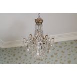 BRASS AND CRYSTAL CHANDELIER Direct all shipping enquiries to shipping@sheppards.ie 55 cm. high;