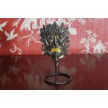 ART METAL CANDLE HOLDER WITH PIERCED MASK DECORATION Direct all shipping enquiries to shipping@