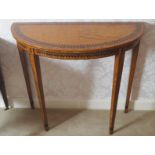 PAIR OF EDWARDIAN PERIOD SATINWOOD AND EBONY INLAID CONSOLE TABLES each with a demi-lune shaped