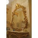LARGE NINETEENTH-CENTURY OVER MANTEL MIRROR the baluster shaped plate within a flower head and