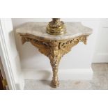 NINETEENTH-CENTURY CARVED GILTWOOD AND GESSO CONSOLE TABLE the serpentine marble top above a C-