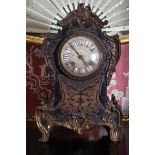 NINETEENTH-CENTURY BUHL, ORMOLU MOUNTED, EBONY AND BRASS INLAID MANTEL CLOCK Direct all shipping