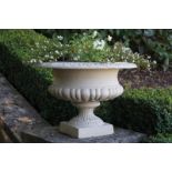 ﻿PAIR OF NINETEENTH-CENTURY CAST-IRON JARDINIÈRES ﻿each with a ribbed bowl raised on a leaf