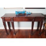 DUBLIN EDWARDIAN PERIOD MAHOGANY SIDE TABLE the rectangular breakfront top, above a fluted frieze,