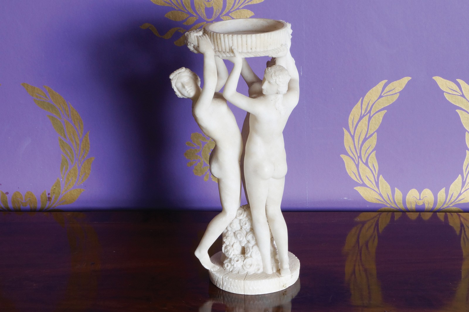 ﻿PARIAN GROUP OF THREE NYMPHS  ﻿holding a flower encrusted ribbed bowl Direct all shipping enquiries