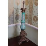 NINETEENTH-CENTURY PARCEL GILT GLASS STEMMED TABLE LAMP raised on an ormolu Rococo scroll base