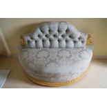 NINETEENTH-CENTURY CARVED GILTWOOD BOUDOIR SETTEE with deep buttoned upholstered back and demi-