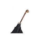 NINETEENTH-CENTURY UMBRELLA  with an ebony stem. The steel handle encrusted with diamonds,