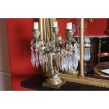 PAIR OF REGENCY PERIOD ORMOLU AND CRYSTAL TWO-LIGHT CANDELABRAS each with leaf and reeded scroll