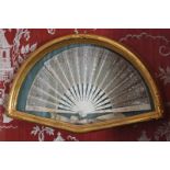 NINETEENTH-CENTURY BONE STEMMED AND SILVER MOUNTED FAN enclosed in a moulded gilt frame Direct all