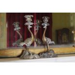 PAIR OF NINETEENTH-CENTURY BRONZE CANDLESTICKS each of Rococo form, the candle bowl supported by a