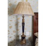 PAIR OF BRASS AND CERAMIC STEMMED TABLE LAMPS each with a sphinx headed stem, complete with