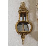 PAIR OF NINETEENTH-CENTURY GILT WOOD AND GESSO HANGING MIRROR BACKED CORNER SHELVES by Charles