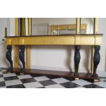 LARGE EBONY AND GILTWOOD CONSOLE TABLE in the manner of Thomas Hope, London; the rectangular moulded