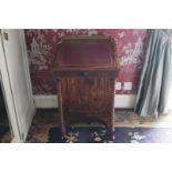 VICTORIAN ROSEWOOD DAVENPORT the square top below a three quarter pierced brass gallery rail,