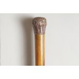 NINETEENTH-CENTURY YEW-WOOD WALKING STICK with a spiral beaded copper handle Direct all shipping