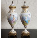 PAIR OF NINETEENTH-CENTURY Sèvres ORMOLU MOUNTED URNS AND COVERS each decorated with a nymph and