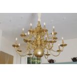 LARGE EDWARDIAN BRASS TWO-TIER, SIXTEEN-BRANCH, SCROLL ARMED CHANDELIER with ball finial Direct