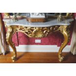 IRISH NINETEENTH-CENTURY CARVED GILTWOOD CONSOLE TABLE the veined white marble serpentine shaped