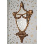 PAIR OF NINETEENTH-CENTURY CARVED GILTWOOD PIER MIRRORS the two-part shield shaped plate within a