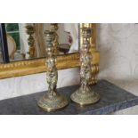 PAIR OF NINETEENTH-CENTURY FRENCH BRONZE CANDLESTICKS each with a figural stem and circular base