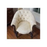 NINETEENTH-CENTURY MAHOGANY AND UPHOLSTERED DEEP-BUTTONED ARMCHAIR with carved scroll fronts