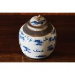 NINETEENTH-CENTURY CHINESE QING PERIOD BLUE AND WHITE JAR AND COVER with dragon and floating cloud