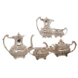 FIVE-PIECE SILVER TEA AND COFFEE SERVICE each of oval form with a gadrooned rim and ribbed body,