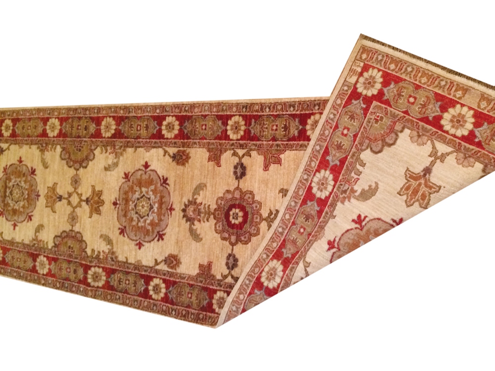 Handmade North West Persian runner on ivory ground, with red border Worldwide shipping available: