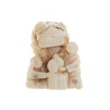 Nineteenth-century Japanese netsuke  of a festival character with children Worldwide shipping