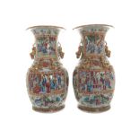 Pair of nineteenth-century Cantonese vases each of baluster form, draped with kylin, and painted