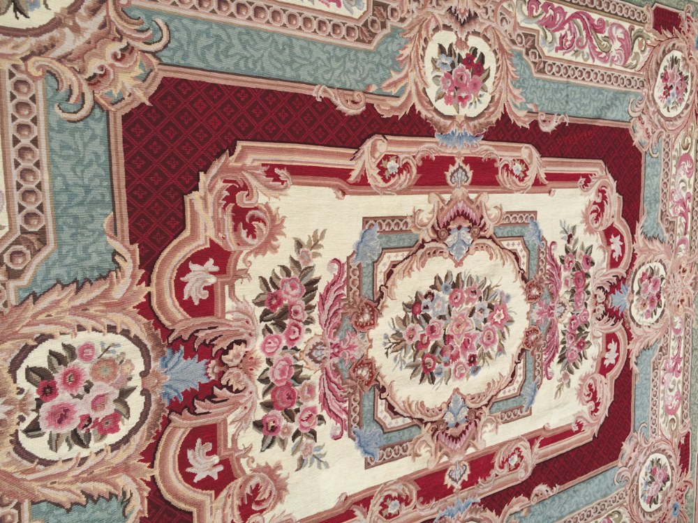 Handmade Aubusson, France carpet, circa 1950 with hand sewn backing, central medallion surrounded by