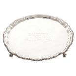 Irish silver salver of circular serpentine form, raised on claw and ball feet, inscribed 'Mr B. P