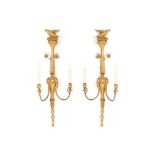 Pair of George III period giltwood and gesso wall lights each with lion mask decoration,