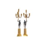 Pair of Regency period gilt bronze figural candelabras each of three-scroll arms, with canine head