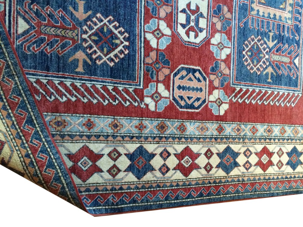 Handmade Kazakh carpet Caucasus region of Azerbaijan, with ivory border and two rectangular blue